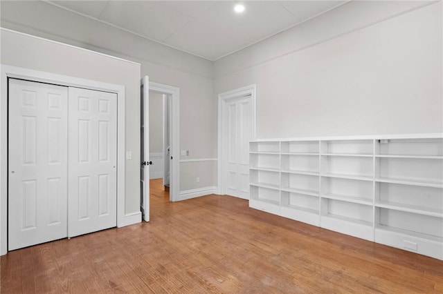 81 Old N Rd, South Kingstown, RI 02881 - unfurnished bedroom with wood finished floors, baseboards, a closet, and recessed lighting