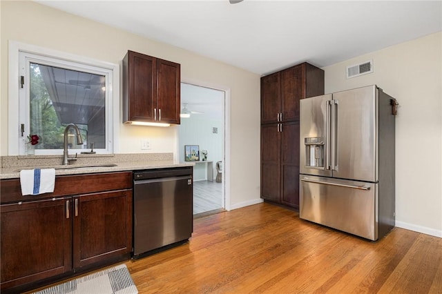 14 Twin Oak Dr, Warwick, RI 02889 - kitchen featuring high end refrigerator, dishwashing machine, light wood-style floors, and dark brown cabinets