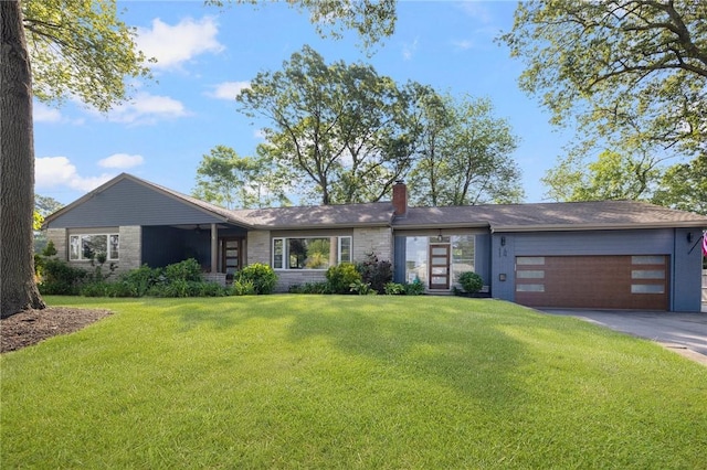 14 Twin Oak Dr, Warwick, RI 02889 - view of front facade with a chimney, a front yard, asphalt driveway, a garage, and stone siding