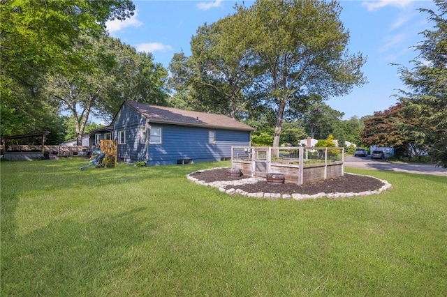 14 Twin Oak Dr, Warwick, RI 02889 - view of grassy yard featuring a garden