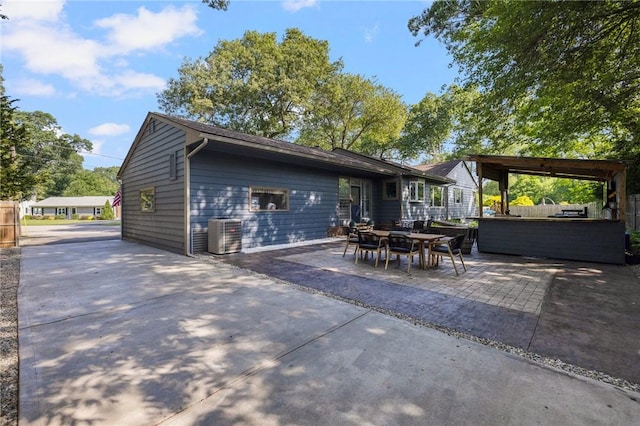 14 Twin Oak Dr, Warwick, RI 02889 - rear view of house with a patio area