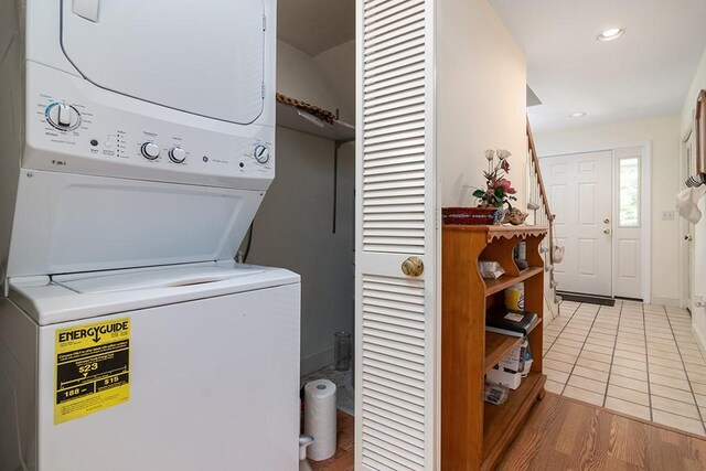 223 Corey Ln, Middletown, RI 02842 - laundry area with estacked washer and dryer, recessed lighting, and tile patterned flooring