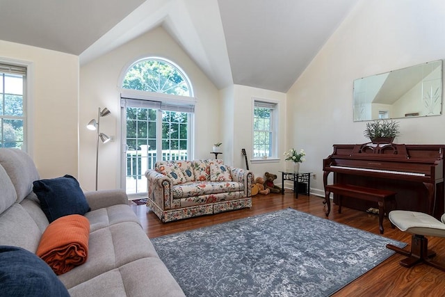223 Corey Ln, Middletown, RI 02842 - living room featuring vaulted ceiling, plenty of natural light, and wood finished floors