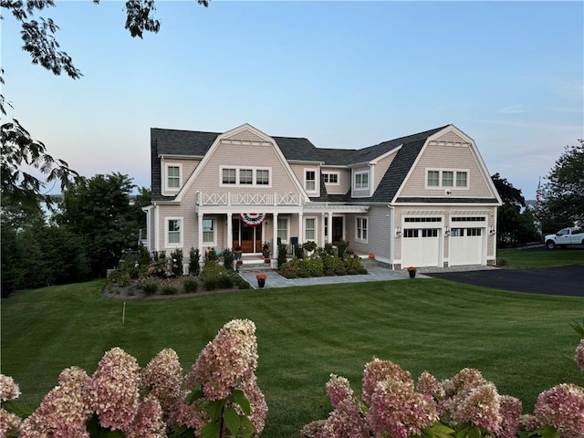 0 Surf Dr, Bristol, RI 02809 - shingle-style home with a gambrel roof, asphalt driveway, a front lawn, and a porch
