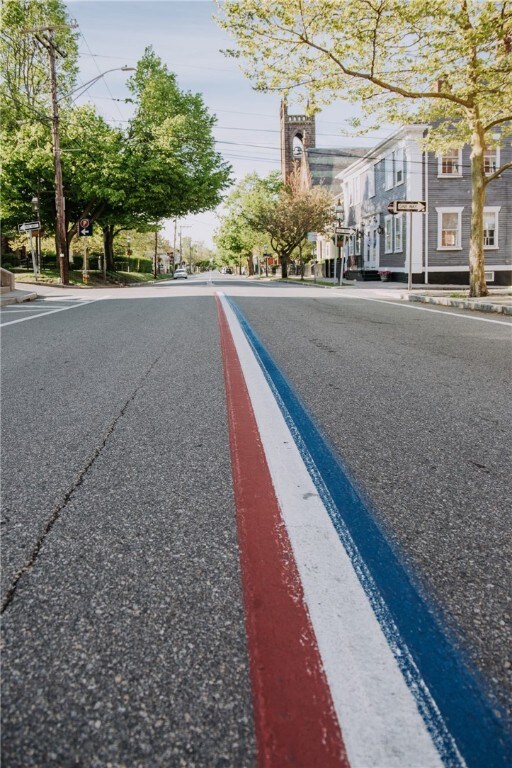 0 Surf Dr, Bristol, RI 02809 - view of asphalt street with street lights, sidewalks, and curbs