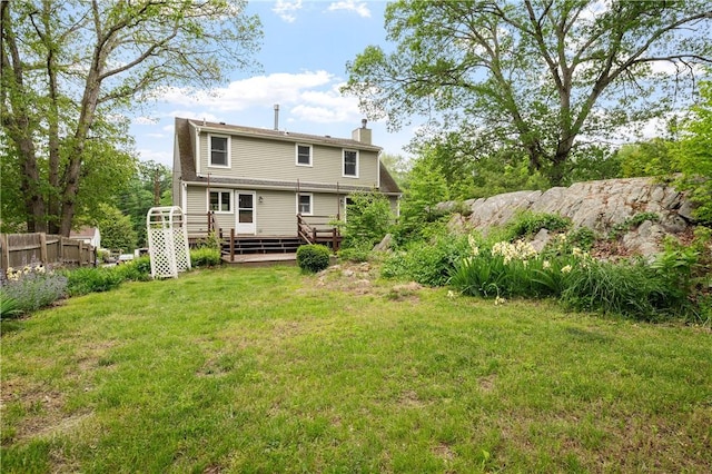 21 Diana Ave, Smithfield, RI 02917 - back of house with a chimney and a wooden deck