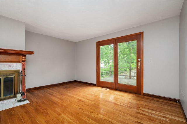 21 Diana Ave, Smithfield, RI 02917 - unfurnished living room featuring light wood finished floors, a high end fireplace, and baseboards