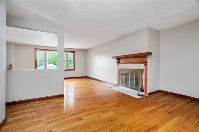 21 Diana Ave, Smithfield, RI 02917 - unfurnished living room with light wood-type flooring, baseboards, and a premium fireplace