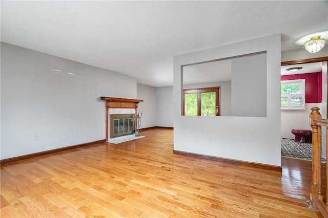 21 Diana Ave, Smithfield, RI 02917 - unfurnished living room with light wood-style floors, a fireplace, and baseboards