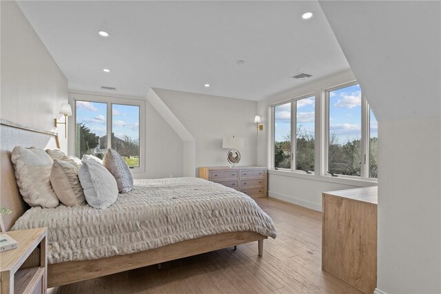 8 J H Dwyer Dr, Middletown, RI 02842 - bedroom with light wood-type flooring, multiple windows, baseboards, and recessed lighting