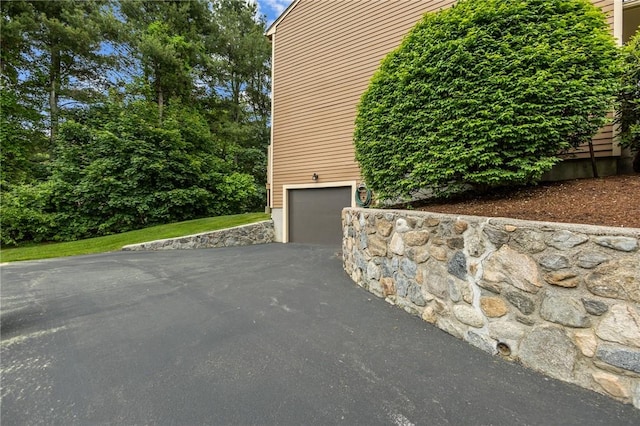 2 Tamarac Dr Unit A, Smithfield, RI 02828 - view of side of home featuring asphalt driveway and a garage