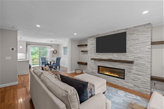 2 Tamarac Dr Unit A, Smithfield, RI 02828 - living room with ornamental molding, wood finished floors, a fireplace, recessed lighting, and baseboards