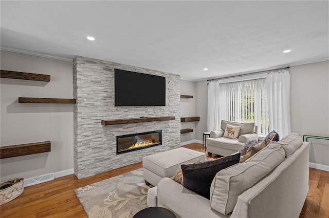 2 Tamarac Dr Unit A, Smithfield, RI 02828 - living room featuring crown molding, baseboards, wood finished floors, a fireplace, and recessed lighting