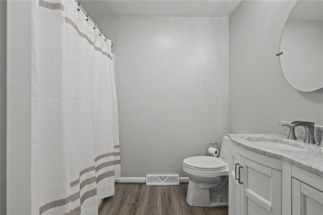 2 Tamarac Dr Unit A, Smithfield, RI 02828 - full bath featuring toilet, vanity, wood finished floors, baseboards, and a shower with shower curtain
