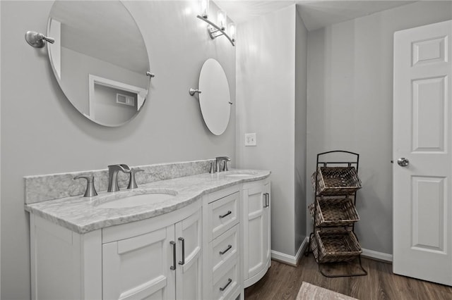 2 Tamarac Dr Unit A, Smithfield, RI 02828 - bathroom featuring double vanity, wood finished floors, and baseboards