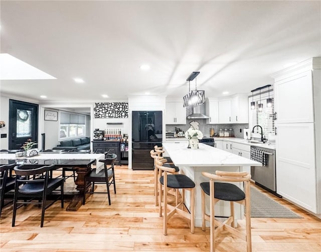 1 Sharp St, Coventry, RI 02816 - kitchen featuring stainless steel dishwasher, wall chimney exhaust hood, healthy amount of natural light, a center island, and recessed lighting