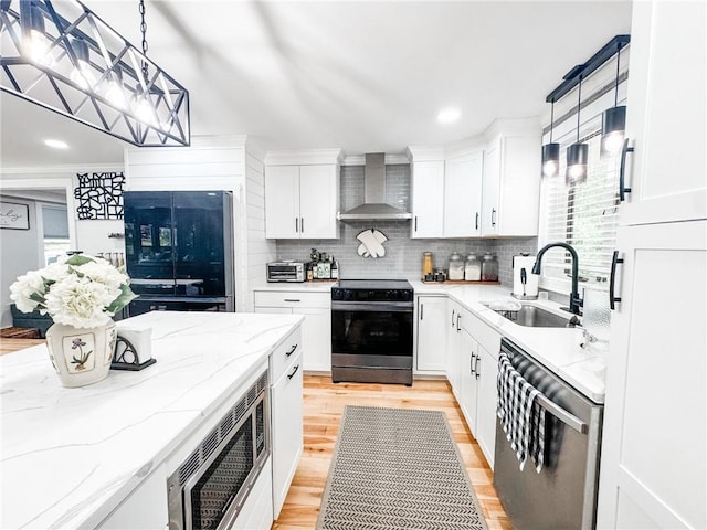 1 Sharp St, Coventry, RI 02816 - kitchen with wall chimney exhaust hood, stainless steel dishwasher, electric stove, black fridge, and tasteful backsplash