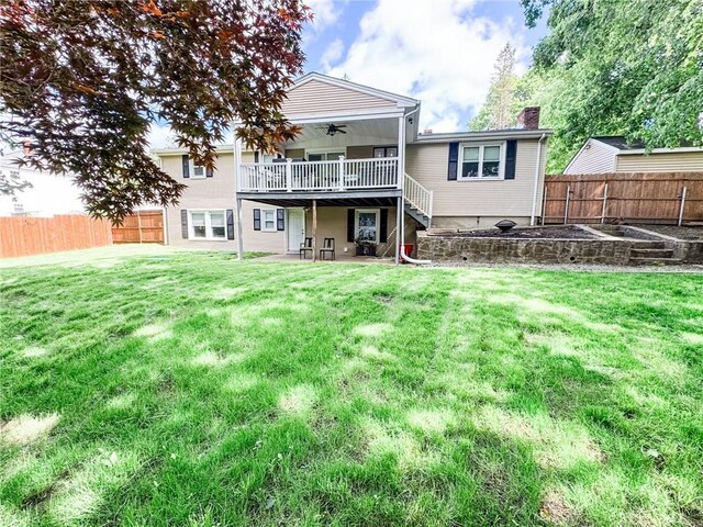 1 Sharp St, Coventry, RI 02816 - back of property with a ceiling fan, a wooden deck, a patio area, and a chimney