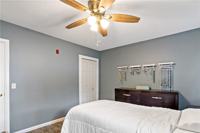 3940 Post Rd Unit 30, Warwick, RI 02886 - bedroom with wood finished floors, baseboards, ceiling fan, and a closet