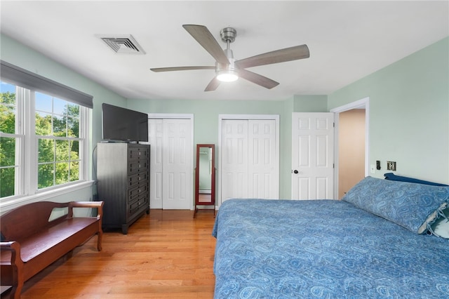 99 Post Rd Unit F1, Warwick, RI 02888 - bedroom with light wood-type flooring, multiple closets, and a ceiling fan