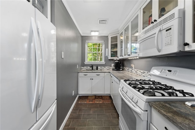 99 Post Rd Unit F1, Warwick, RI 02888 - kitchen with white appliances, crown molding, white cabinets, a sink, and glass insert cabinets