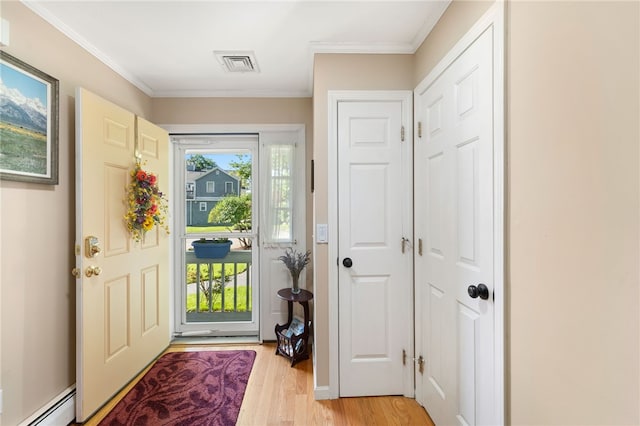 99 Post Rd Unit F1, Warwick, RI 02888 - entrance foyer featuring a baseboard radiator, light wood-style floors, and crown molding