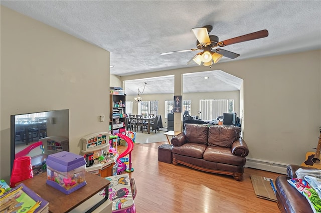 179 Armistice Blvd, Pawtucket, RI 02860 - living area with baseboard heating, ceiling fan, a textured ceiling, wood finished floors, and a chandelier