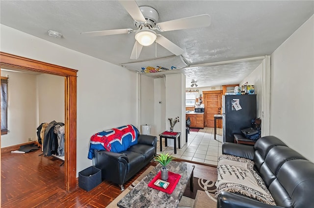 179 Armistice Blvd, Pawtucket, RI 02860 - living room with light wood-style flooring, ceiling fan, and a textured ceiling