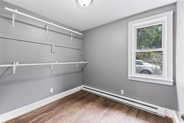 10 Sisson St, West Warwick, RI 02893 - spacious closet featuring a baseboard radiator and dark wood-style floors