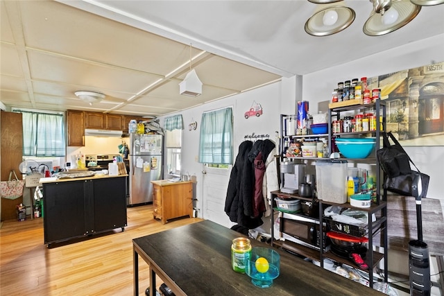 10 Sisson St, West Warwick, RI 02893 - kitchen featuring appliances with stainless steel finishes, light wood-style floors, plenty of natural light, and brown cabinetry