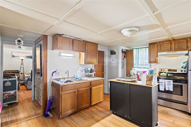 10 Sisson St, West Warwick, RI 02893 - kitchen featuring stainless steel electric range, under cabinet range hood, a sink, light wood-style flooring, and brown cabinetry