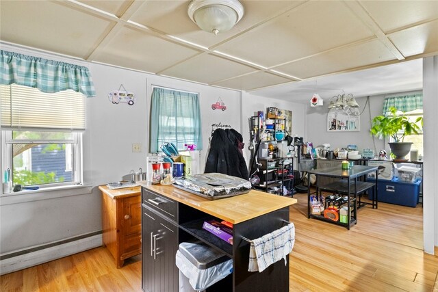 10 Sisson St, West Warwick, RI 02893 - home office featuring a baseboard heating unit and light wood finished floors