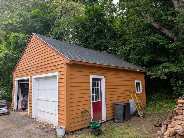 94 Mount Pleasant Rd, North Smithfield, RI 02896 - detached garage featuring view of scattered trees