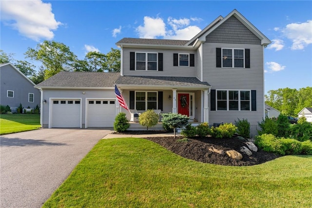 25 Ironwood Dr, Coventry, RI 02816 - view of front facade with a garage, covered porch, asphalt driveway, and a front yard