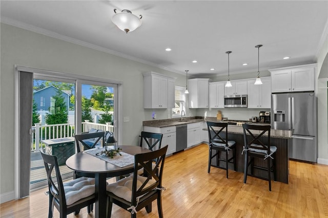 25 Ironwood Dr, Coventry, RI 02816 - dining area with ornamental molding, light wood finished floors, recessed lighting, and baseboards