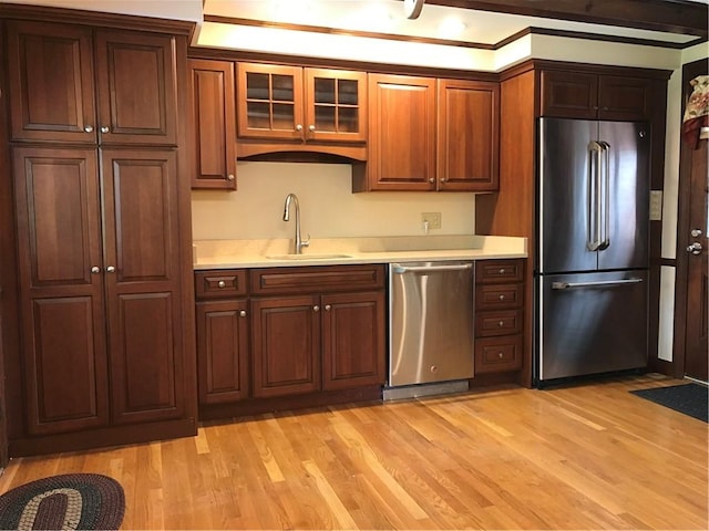 33 Red Gate Rd, Cumberland, RI 02864 - kitchen with stainless steel appliances, a sink, light countertops, and light wood finished floors