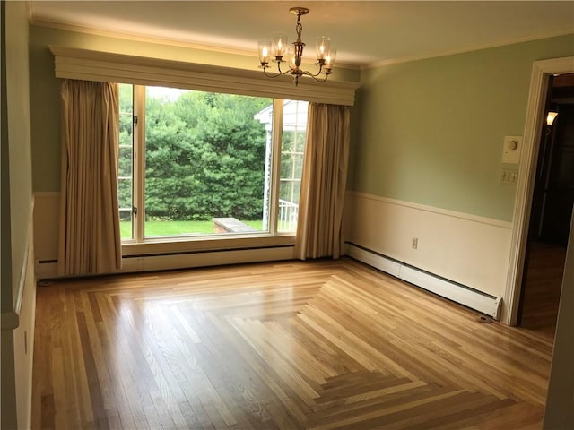 33 Red Gate Rd, Cumberland, RI 02864 - spare room with baseboard heating, a chandelier, plenty of natural light, and ornamental molding