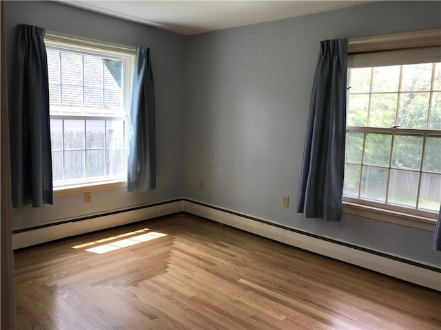 33 Red Gate Rd, Cumberland, RI 02864 - unfurnished room featuring light wood-style floors and a baseboard heating unit