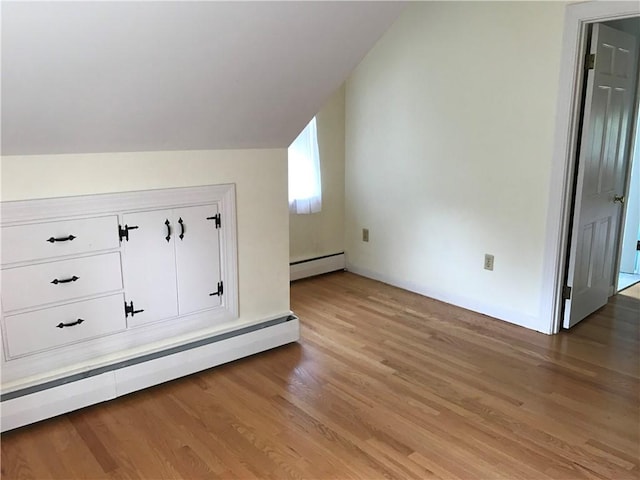 33 Red Gate Rd, Cumberland, RI 02864 - bonus room with baseboard heating, lofted ceiling, light wood-style floors, and baseboards