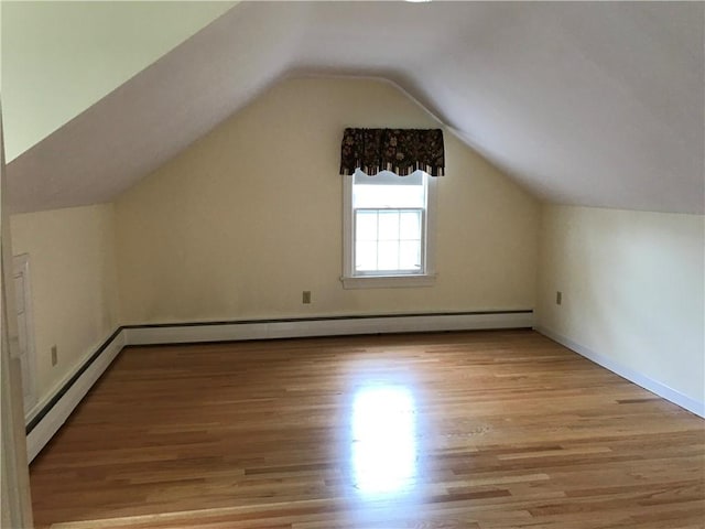 33 Red Gate Rd, Cumberland, RI 02864 - bonus room featuring light wood-style flooring, lofted ceiling, a baseboard radiator, and baseboards