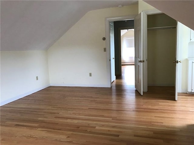33 Red Gate Rd, Cumberland, RI 02864 - bonus room featuring wood finished floors, vaulted ceiling, and baseboards