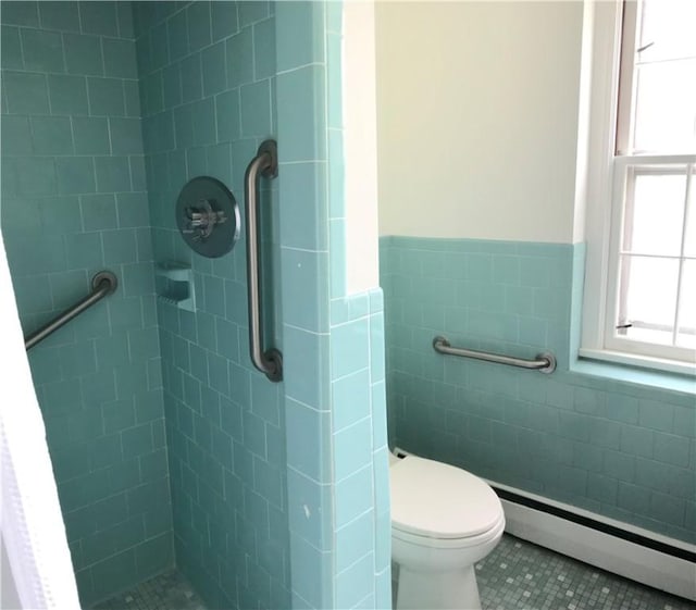 33 Red Gate Rd, Cumberland, RI 02864 - bathroom with a baseboard radiator, tile walls, a stall shower, tile patterned flooring, and toilet