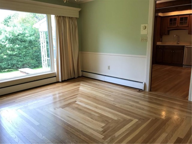 33 Red Gate Rd, Cumberland, RI 02864 - empty room featuring a baseboard radiator and a sink