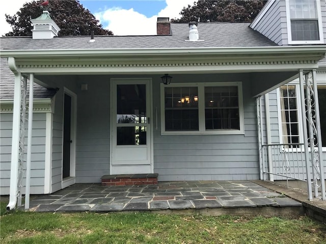 33 Red Gate Rd, Cumberland, RI 02864 - rear view of property with a porch, a chimney, and roof with shingles