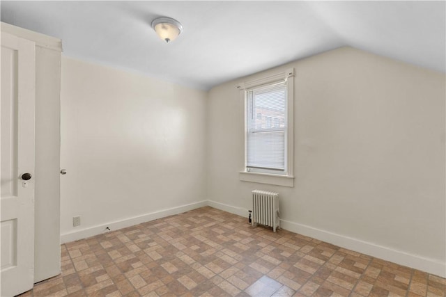 483 Dexter St, Providence, RI 02907 - additional living space featuring radiator, brick patterned flooring, vaulted ceiling, and baseboards