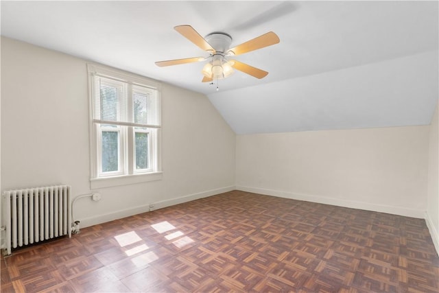 483 Dexter St, Providence, RI 02907 - bonus room featuring radiator, vaulted ceiling, baseboards, and a ceiling fan