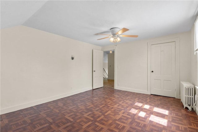 483 Dexter St, Providence, RI 02907 - unfurnished bedroom featuring radiator heating unit, baseboards, a ceiling fan, and vaulted ceiling