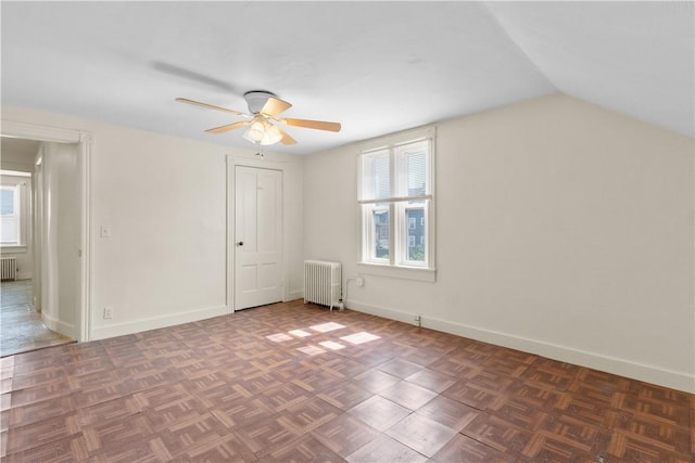483 Dexter St, Providence, RI 02907 - bonus room with radiator heating unit, a ceiling fan, healthy amount of natural light, lofted ceiling, and baseboards