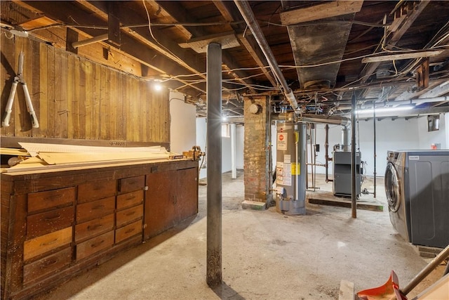 483 Dexter St, Providence, RI 02907 - unfinished below grade area featuring water heater, washer / dryer, a heating unit, and wood walls