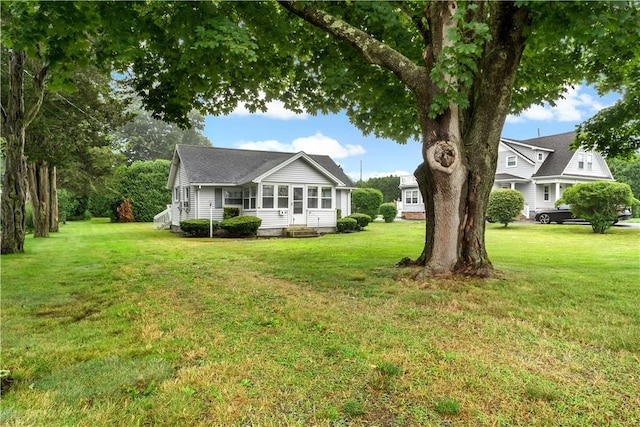 86 Winnapaug Rd, Westerly, RI 02891 - view of front of home with a front lawn, a sunroom, and entry steps